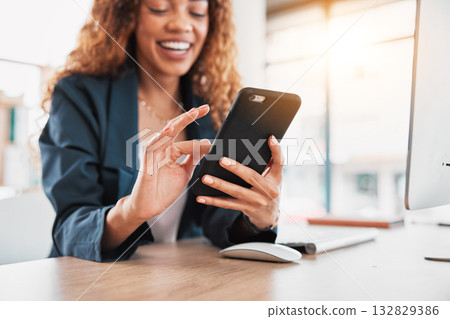Phone, hand and communication with a business black woman laughing at a meme in her office at work. Contact, social media and mobile with a female employee browsing the internet for a joke or humor 132829386