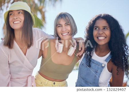 Portrait, friends and hug while at a beach walking, talking and bonding on summer holiday. Diversity, face and women embrace on walk outdoors for travel, vacation and trip in Miami together 132829407