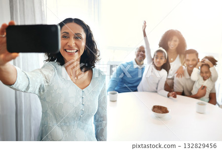 Love, grandmother and family with selfie, smile and bonding on break, fun and spending quality time together. Grandparents, children and parents with smartphone, happiness and cheerful in living room 132829456