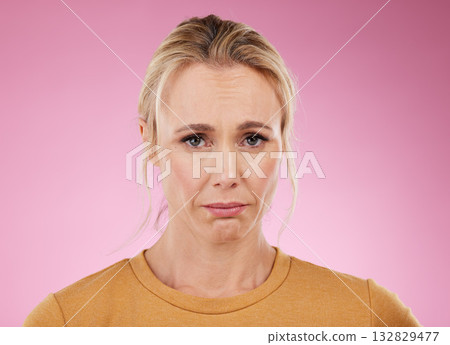 Portrait, woman and sad with mental health, depression and lady against studio background. Face, mature female and stress with anxiety, fatigue and suffering from loneliness, anxious and problems Portrait, woman and sad with mental health, depression and lady against studio background. Face, mature female and stress with anxiety, fatigue and suffering from loneliness, anxious and problems 132829477