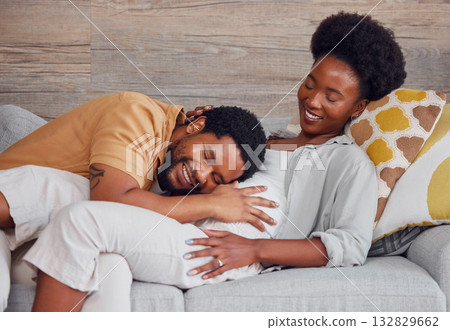 Pregnant, black couple and listening to stomach while excited and happy on lounge couch. Man and woman together talking pregnancy future, love and life insurance for healthy lifestyle and heartbeat 132829662