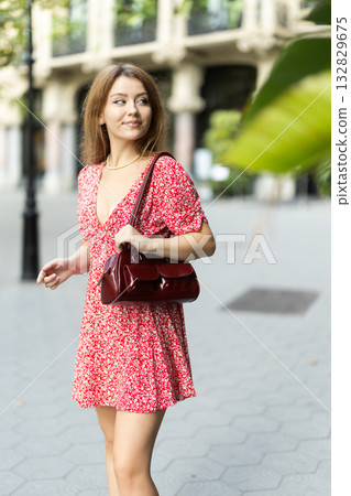 Young woman walking around city 132829675