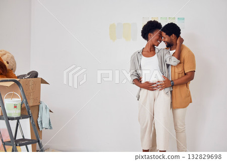 Forehead, pregnancy or black couple hugging in home renovation, diy or house remodel together by apartment. Lovers, partnership or African man and pregnant woman excited about baby or new family Forehead, pregnancy or black couple hugging in home renovation, diy or house remodel together by apartment. Lovers, partnership or African man and pregnant woman excited about baby or new family 132829698