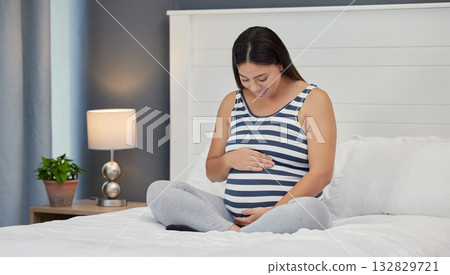 Pregnant, bed and mother with hands on abdomen holding stomach for baby, infant and child affection at home. Pregnancy love, family and excited, loving and happy woman rest, relax and calm in bedroom Pregnant, bed and mother with hands on abdomen holding stomach for baby, infant and child affection at home. Pregnancy love, family and excited, loving and happy woman rest, relax and calm in bedroom 132829721