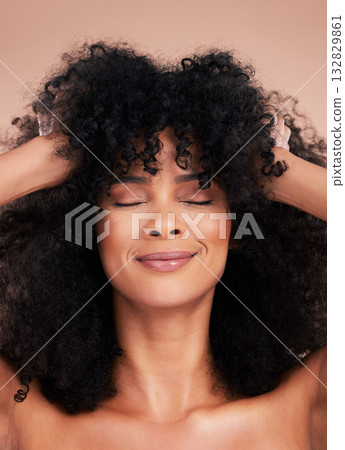 Black woman, hair care and beauty of face in studio for shampoo growth and shine. Happy aesthetic model with natural curly afro for cosmetics, facial skincare and makeup glow on a studio background 132829861