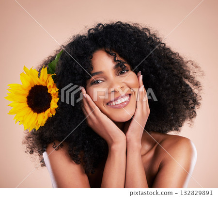 Black woman, studio portrait and sunflower with skincare, beauty or cosmetic wellness by beige background. African gen z model, flower and spring aesthetic with happiness, self care or natural makeup 132829891