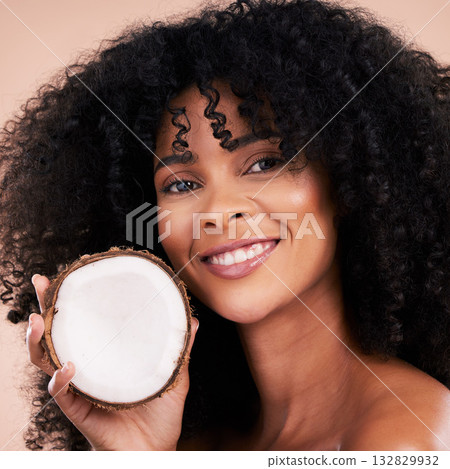 Black woman, studio portrait and coconut with smile, skincare and health with self care by beige background. Happy african model, face and fruit for natural aesthetic, healthy nutrition and cosmetic Black woman, studio portrait and coconut with smile, skincare and health with self care by beige background. Happy african model, face and fruit for natural aesthetic, healthy nutrition and cosmetic 132829932