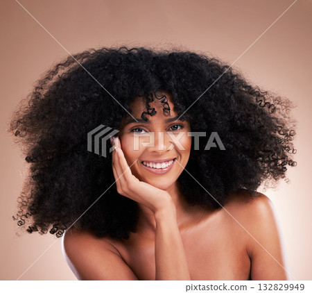 Afro, hair and portrait of black woman with smile on brown background for wellness, shine and natural glow. Salon, luxury treatment and happy girl face with curly hairstyle, healthy skin and growth 132829949