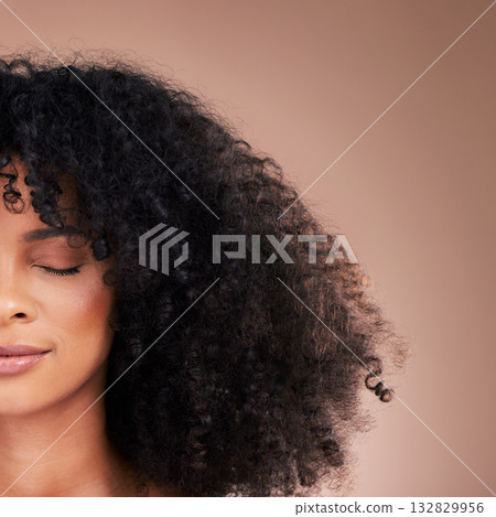 Half face, black woman or afro hair on studio background for product placement, curly mockup or skincare treatment management. Beauty model, natural or hairstyle with makeup on isolated wall mock up Half face, black woman or afro hair on studio background for product placement, curly mockup or skincare treatment management. Beauty model, natural or hairstyle with makeup on isolated wall mock up 132829956