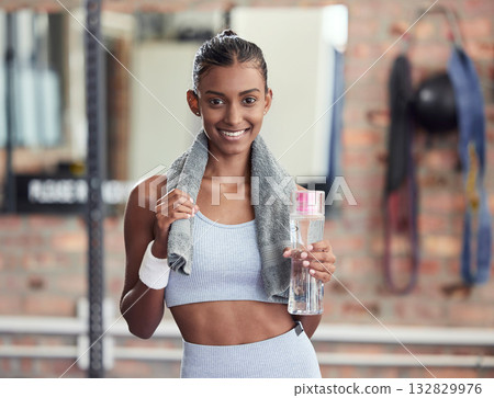 Woman, fitness and portrait smile with water bottle and sweat towel for exercise, workout or training at gym. Happy female smiling with drink for refreshment, hydration or healthy cardio wellness Woman, fitness and portrait smile with water bottle and sweat towel for exercise, workout or training at gym. Happy female smiling with drink for refreshment, hydration or healthy cardio wellness 132829976