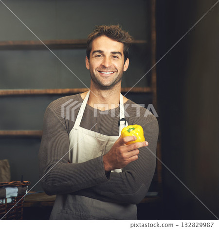 Chef, bell pepper and portrait of man in kitchen with vegetables for vegetarian, healthy diet or vegan ingredients. Smile, male cook holding capsicum and food from Norway for cooking in restaurant. 132829987
