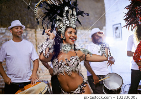Carnival, dance and cultural female dancer performing with band at mardi gras or exotic festival. Performance, costume and woman dancing with rhythm to live music for entertainment in Rio de janeiro. 132830005