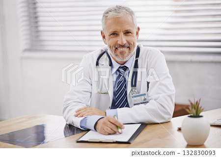 Healthcare, portrait and male doctor with a clipboard in his office analyzing xray document in hospital. Confidence, smile and professional mature man medical worker with paperwork by desk in clinic. 132830093