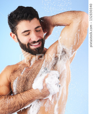Wellness, man and foam for cleaning, morning routine for hygiene, grooming and daily washing on blue studio background. Male, guy or drops of aqua, showering for freshness, luxury or soap on backdrop Wellness, man and foam for cleaning, morning routine for hygiene, grooming and daily washing on blue studio background. Male, guy or drops of aqua, showering for freshness, luxury or soap on backdrop 132830340