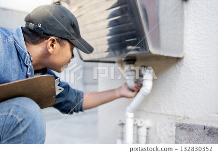 Man, plumber and check faucet pipes for building maintenance, renovation and builder service. Handyman, pipeline and plumbing inspection for leak, drainage and installation of system, sink and repair Man, plumber and check faucet pipes for building maintenance, renovation and builder service. Handyman, pipeline and plumbing inspection for leak, drainage and installation of system, sink and repair 132830352