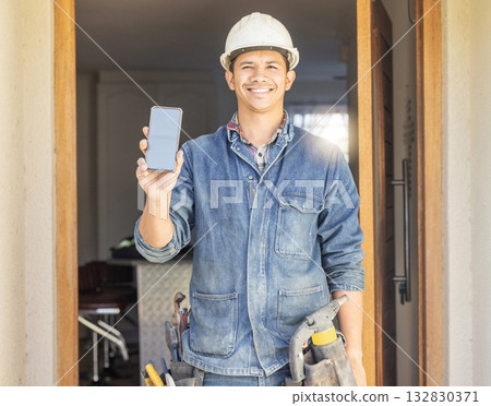 Construction worker, man in portrait and phone, screen with mockup and contact, digital marketing and handyman. Home renovation, maintenance and industry trade promo with product placement advert Construction worker, man in portrait and phone, screen with mockup and contact, digital marketing and handyman. Home renovation, maintenance and industry trade promo with product placement advert 132830371