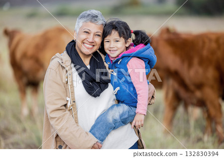 Bonding, happy and portrait of a grandmother with child on a farm for farming experience in South Africa. Nature, love and senior woman with a girl on countryside for agriculture and sustainability Bonding, happy and portrait of a grandmother with child on a farm for farming experience in South Africa. Nature, love and senior woman with a girl on countryside for agriculture and sustainability 132830394