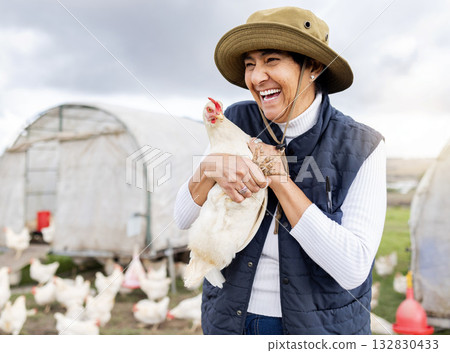 Happy farmer, woman and chicken for agriculture in field, environment and countryside. Poultry farming, female worker and feather birds for sustainability, eggs production and sustainable food trade 132830433