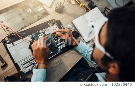 Hardware, engineering and IT professional repair motherboard, microcircuit or electronic device in a workshop or shop. Overhead, man and guy fixing a computer for technology in a lab or factory 132830440
