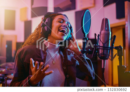 Recording, music and woman singing in a studio for radio, song production and rehearsal. Creative, voice and singer making a record, track or musical sound with a talent as a professional artist 132830692