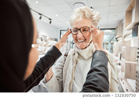 Glasses, vision and optometry with a senior woman in an optician office for prescription lenses. Eyewear, eyesight and fashion with a mature customer buying new frame spectacles at the optometrist Glasses, vision and optometry with a senior woman in an optician office for prescription lenses. Eyewear, eyesight and fashion with a mature customer buying new frame spectacles at the optometrist 132830750