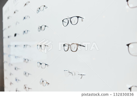 Glasses, frame choice and retail sale in a healthcare, eye wellness and wellness store with no people. Shop stock, eyewear and consumer products on a display stand for shopping and buying in market 132830836