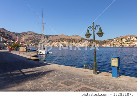 Symi island promenade and harbor view, Symi, Greece Symi island promenade and harbor view, Symi, Greece 132831073