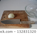 Onions on a cutting board 132831320