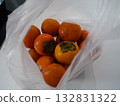 Many persimmons in a plastic bag 132831322