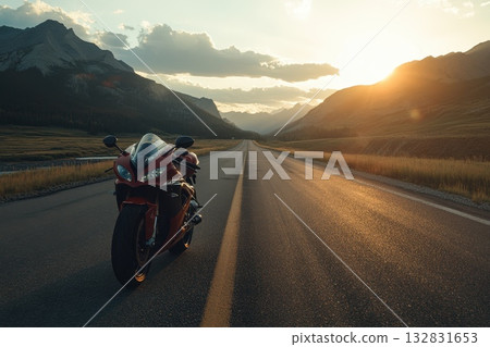 A red motorcycle is parked on a road in front of a mountain range A red motorcycle is parked on a road in front of a mountain range 132831653