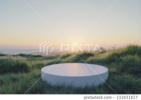 Serene Sunrise Over Flat Grassy Terrain with Stark Horizon and Gentle Ocean View Serene Sunrise Over Flat Grassy Terrain with Stark Horizon and Gentle Ocean View 132831817