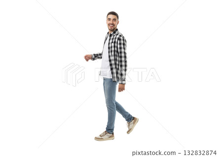 Smiling young man in casual attire walking forward, isolated, PNG Smiling young man in casual attire walking forward, isolated, PNG 132832874