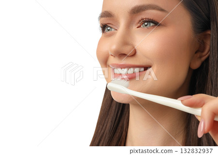 Woman happily brushes her teeth for hygiene, on white, PNG 132832937