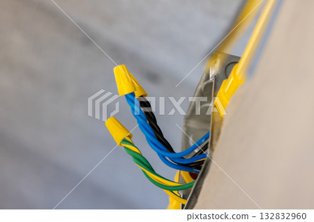 Electrician is using wire nut connectors electrical wires 132832960