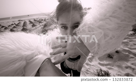 A Stunning Dynamic Photo Capturing a Model Posed in a Surreal and Dreamlike Landscape 132833872