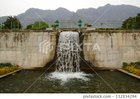 Waterfall in the Nishat  garden Bagh is a popular tourist attraction, Nishat Bagh is a 12-tiered terraced garden located near the famous Dal Lake in Srinagar. It is the second largest Mughal garden. 132834294