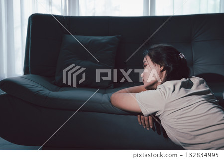 Sorrowful woman sat alone, overwhelmed by emotion, her sad and unhappy expression revealing deep despair, stress and distress left feeling depressed. sorrowful sad, despair alone, depressed stress Sorrowful woman sat alone, overwhelmed by emotion, her sad and unhappy expression revealing deep despair, stress and distress left feeling depressed. sorrowful sad, despair alone, depressed stress 132834995