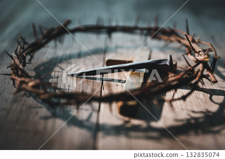 Crucifixion of Jesus Christ, nail-pierced hands, crown of thorns, cross, symbol of Christianity, representing holy sacrifice, passion, faith central to Easter celebration, religious tradition. Crucifixion of Jesus Christ, nail-pierced hands, crown of thorns, cross, symbol of Christianity, representing holy sacrifice, passion, faith central to Easter celebration, religious tradition. 132835074
