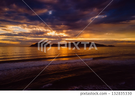 Sunrise and silhouette of island in Florianopolis. Aerial view. 132835330