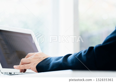 Businessman working on a laptop 132835361