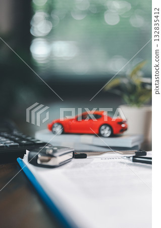 Car loan approval concept. Client finalizes purchase of vehicle by signing contract includes auto loan, insurance, credit terms, making car smart financial investment business-backed finance option. Car loan approval concept. Client finalizes purchase of vehicle by signing contract includes auto loan, insurance, credit terms, making car smart financial investment business-backed finance option. 132835412