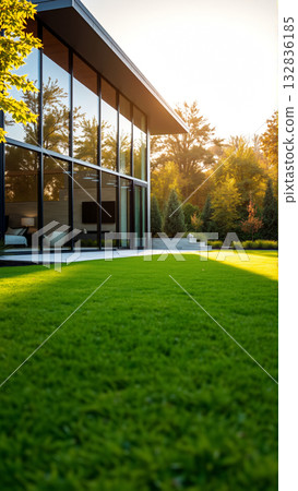 The modern individual residential house is surrounded by a well-groomed beautiful lawn The modern individual residential house is surrounded by a well-groomed beautiful lawn 132836185
