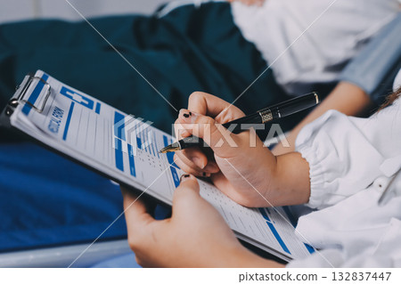 Nurse measuring blood pressure of elderly woman at table, closeup. Assisting senior generation 132837447
