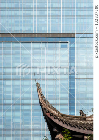 Modern architecture contrasts with traditional temple Modern architecture contrasts with traditional temple 132837580