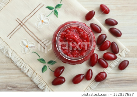 Homemade preserved jam from Cornelian cherry dogwood, lat. Cornus mas macrocarpa, in a jar Homemade preserved jam from Cornelian cherry dogwood, lat. Cornus mas macrocarpa, in a jar 132837687