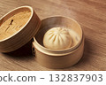 Steamed buns in a bamboo steamer. Steamer, steamed buns, meat buns, pork buns, baozi, etc. Steamed buns in a bamboo steamer. Steamer, steamed buns, meat buns, pork buns, baozi, etc. 132837903