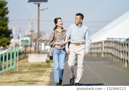 Middle-aged couple taking a walk 132840115