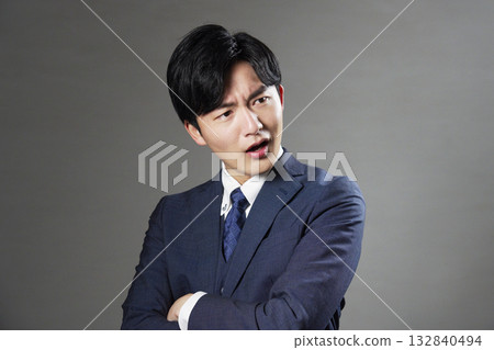 Businessman yelling black background 132840494