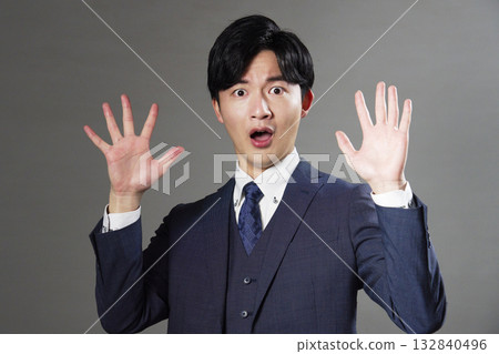 Surprised businessman black background Surprised businessman black background 132840496