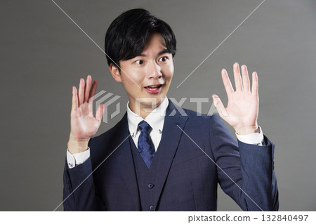 Surprised businessman, black background, facing right 132840497